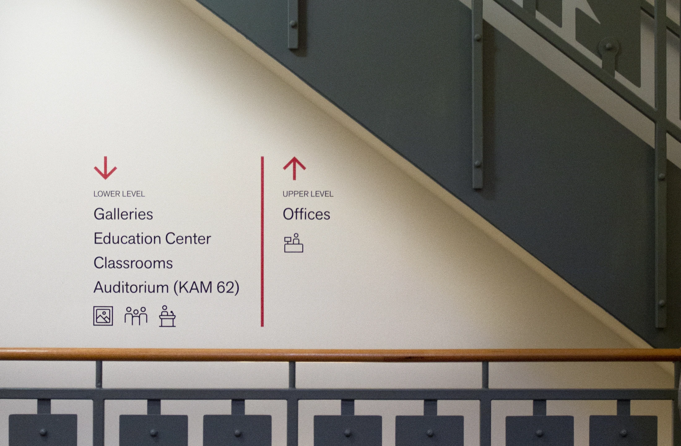 A staircase in a building with a sign on it.