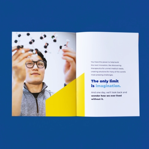An open booklet on a blue background.