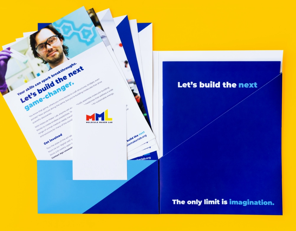An image of a branding spread with various portfolios, folders, and other swag.