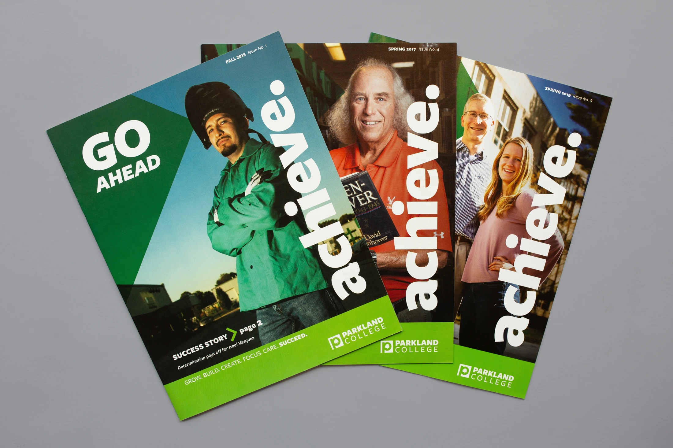 A set of brochures with the words go abroad and achieve.
