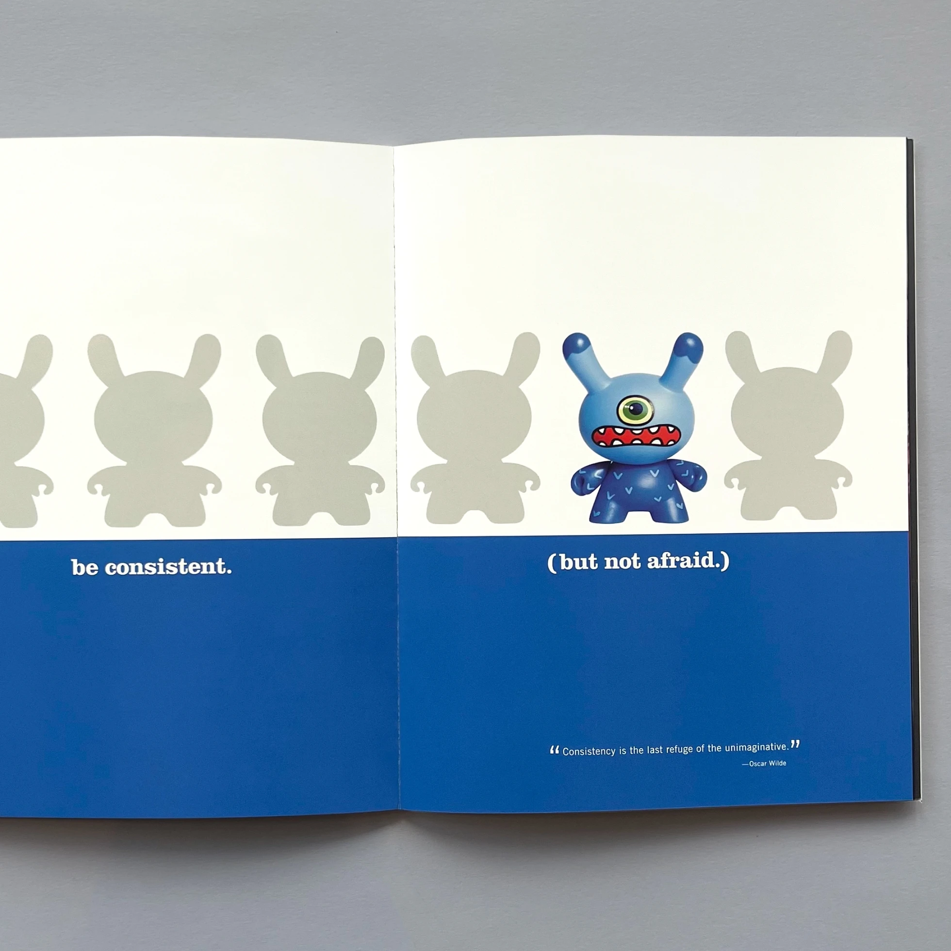 A book with a blue cover and a blue toy on it.