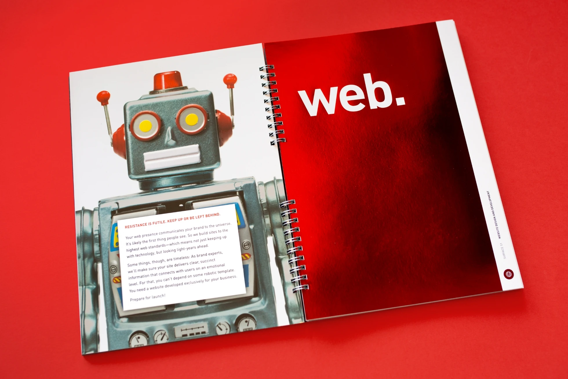 A notebook with a robot on it and the word web.