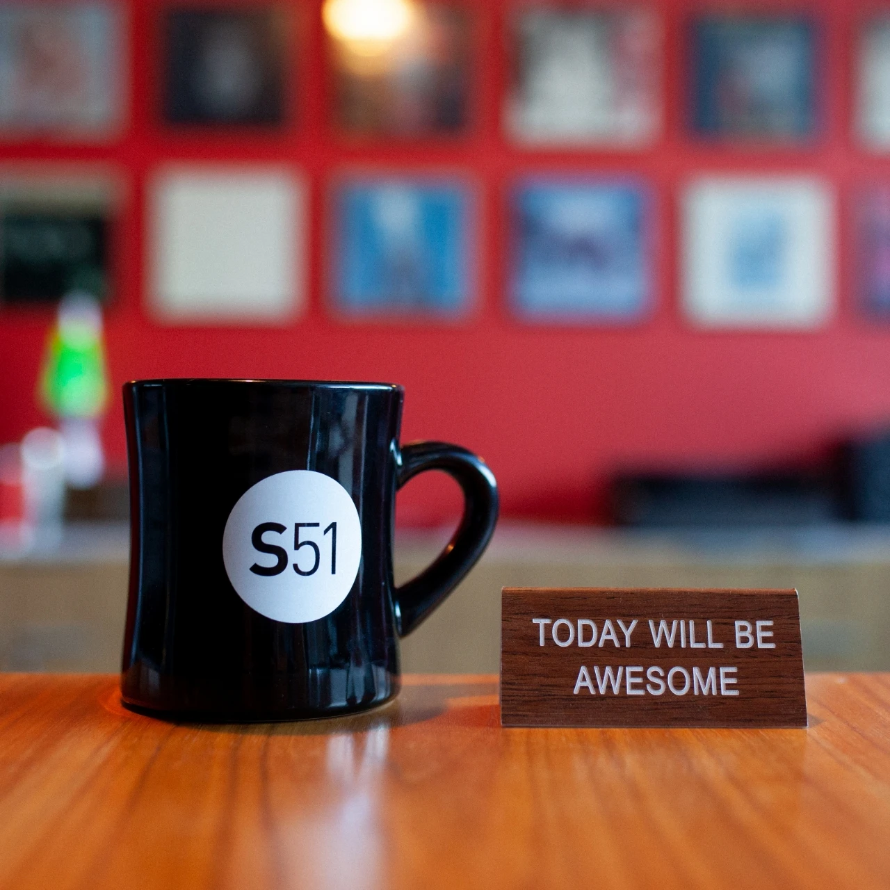 A coffee cup with a sign that says today will be awesome.