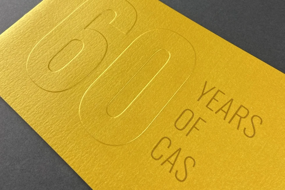 A yellow card with the words 60 years of caas on it.