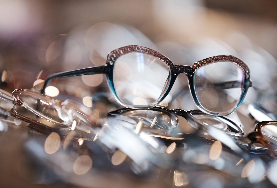 Eyeglasses on a table in a store.